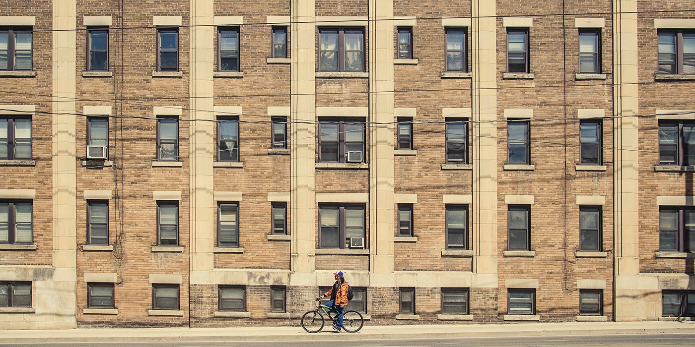 cyclist in front of building