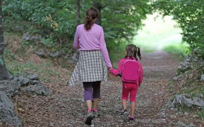mother and child walking outdoors